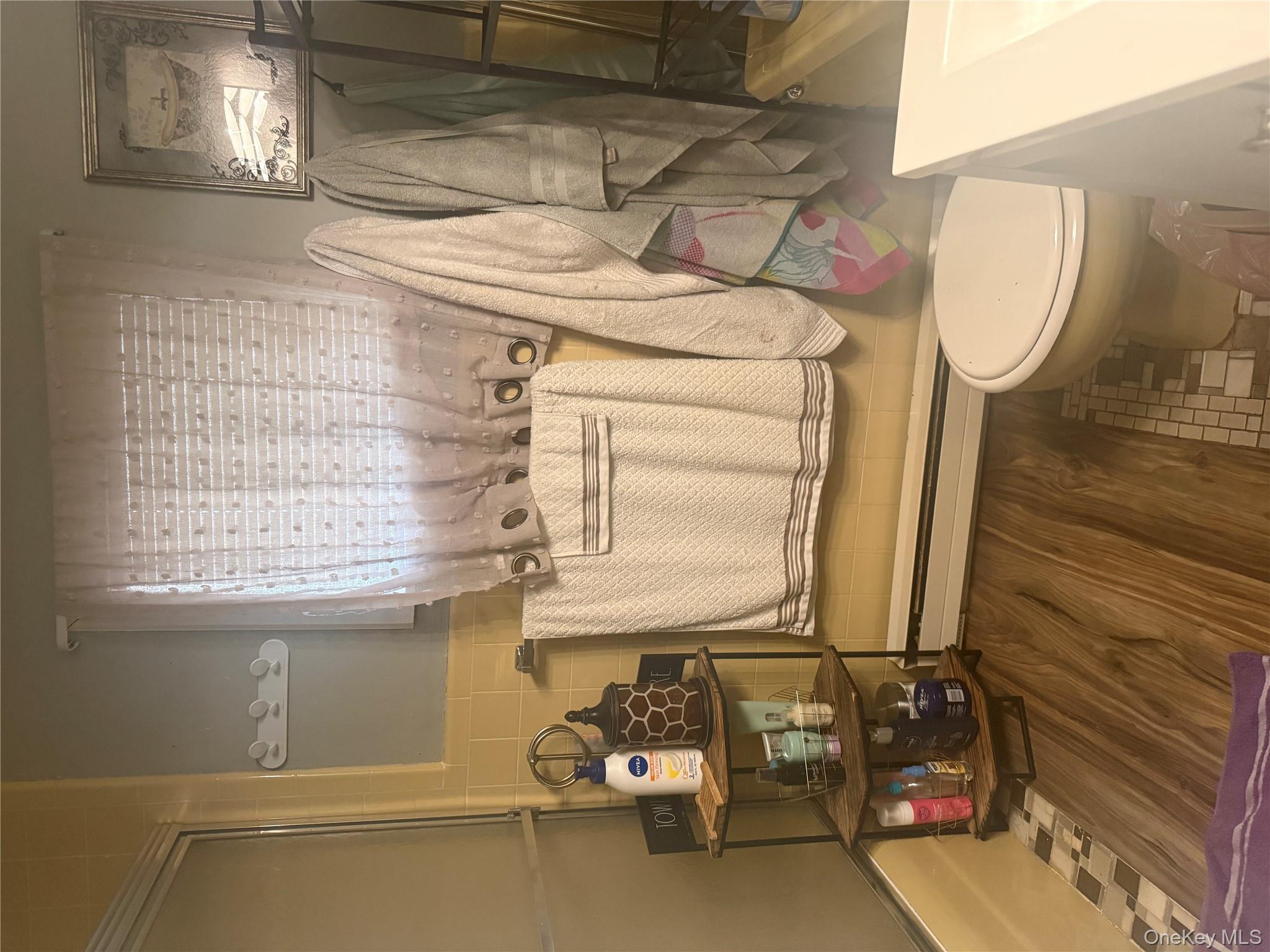 37 Robert Road Kiamesha Lake, NY 12751 - Photo 12 of 25 a bathroom with a sink toilet and shower