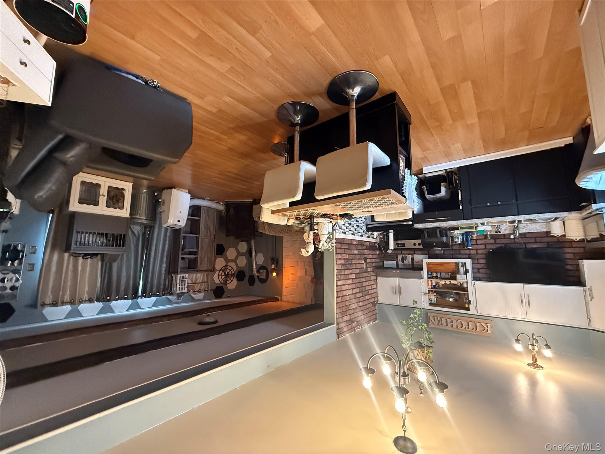 37 Robert Road Kiamesha Lake, NY 12751 - Photo 14 of 25 a living room with stainless steel appliances kitchen island granite countertop furniture wooden floor and a kitchen view