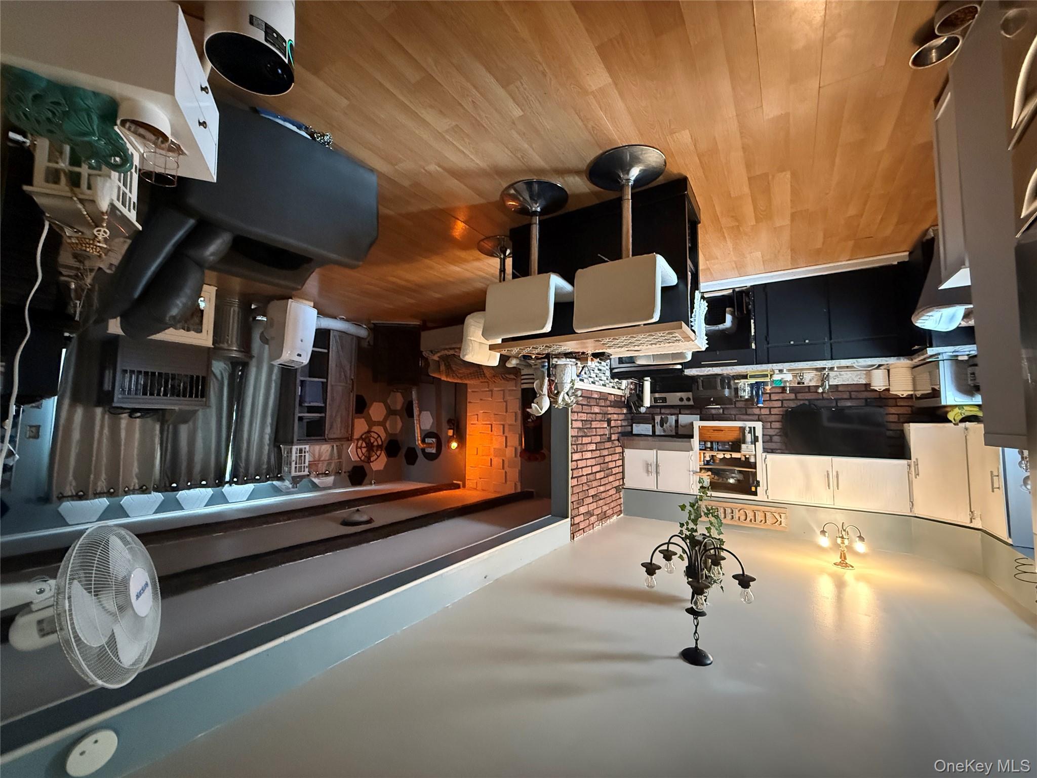 37 Robert Road Kiamesha Lake, NY 12751 - Photo 16 of 25 a living room with lots of furniture and kitchen view