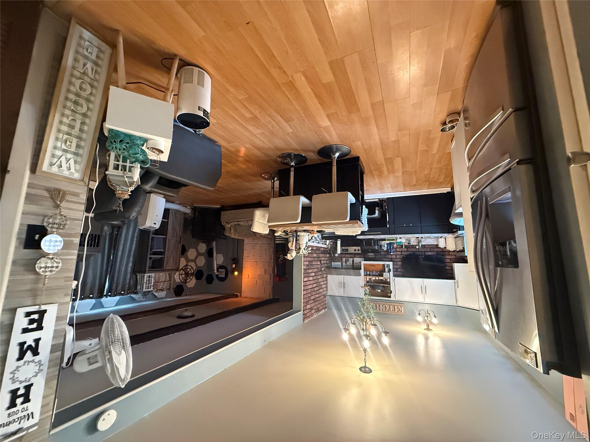 37 Robert Road Kiamesha Lake, NY 12751 - Photo 17 of 25 a view of a dining room with furniture window and wooden floor