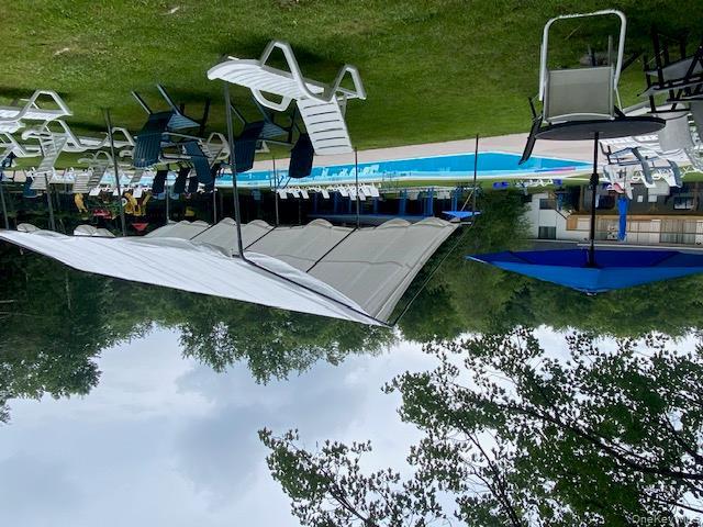 37 Robert Road Kiamesha Lake, NY 12751 - Photo 23 of 25 a view of patio with chairs and table under an umbrella