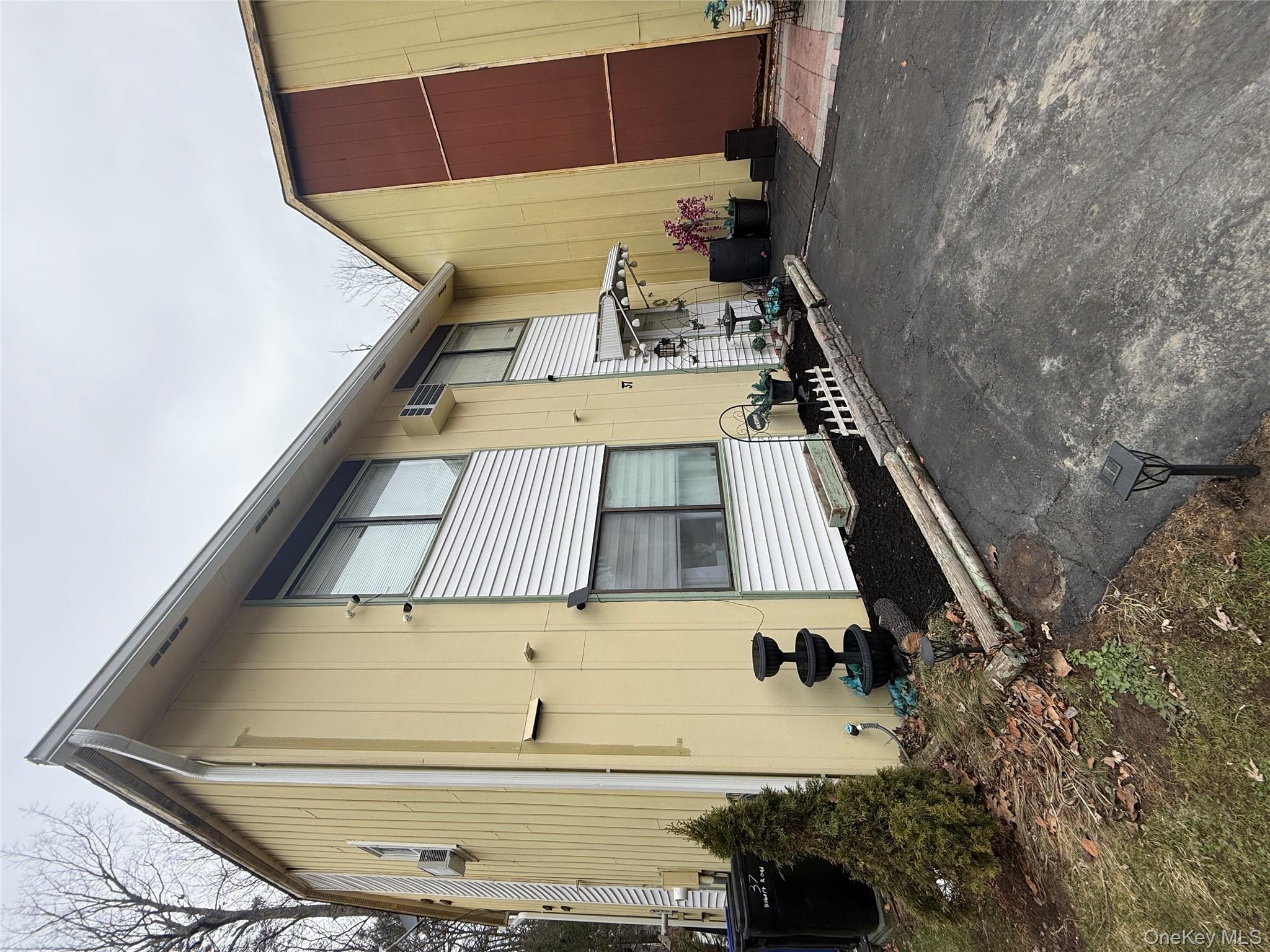 37 Robert Road Kiamesha Lake, NY 12751 - Photo 4 of 25 a house view with a backyard