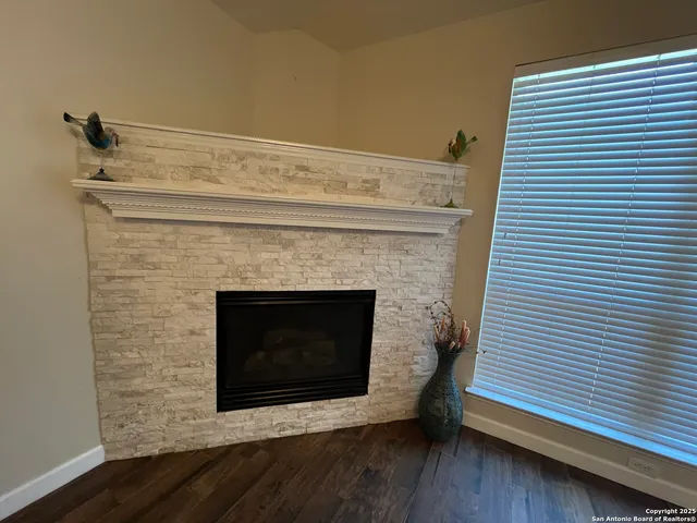 a fireplace with a wooden floor