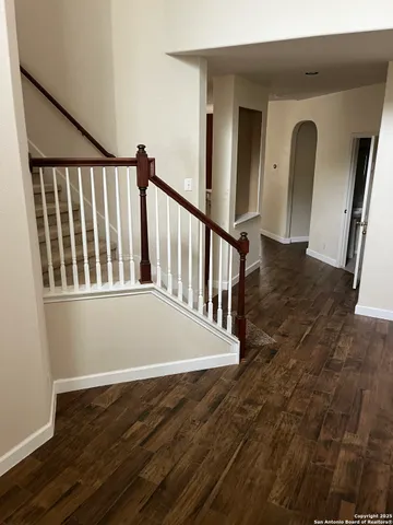 a view of balcony with wooden floor
