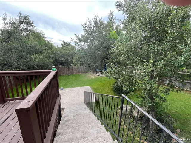 a balcony with wooden floor in outdoor space
