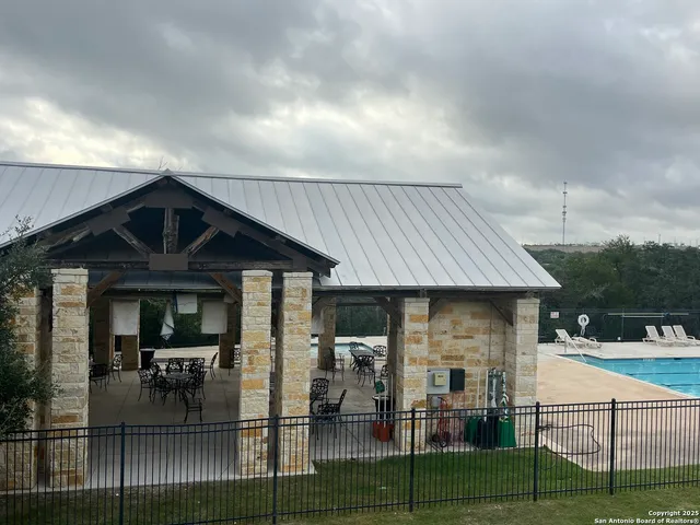 a view of a house with backyard and porch