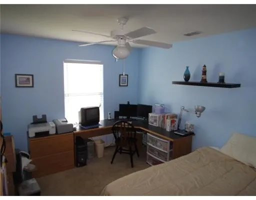 a view of a workspace with furniture