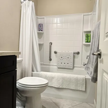 a room with a bed and a dresser