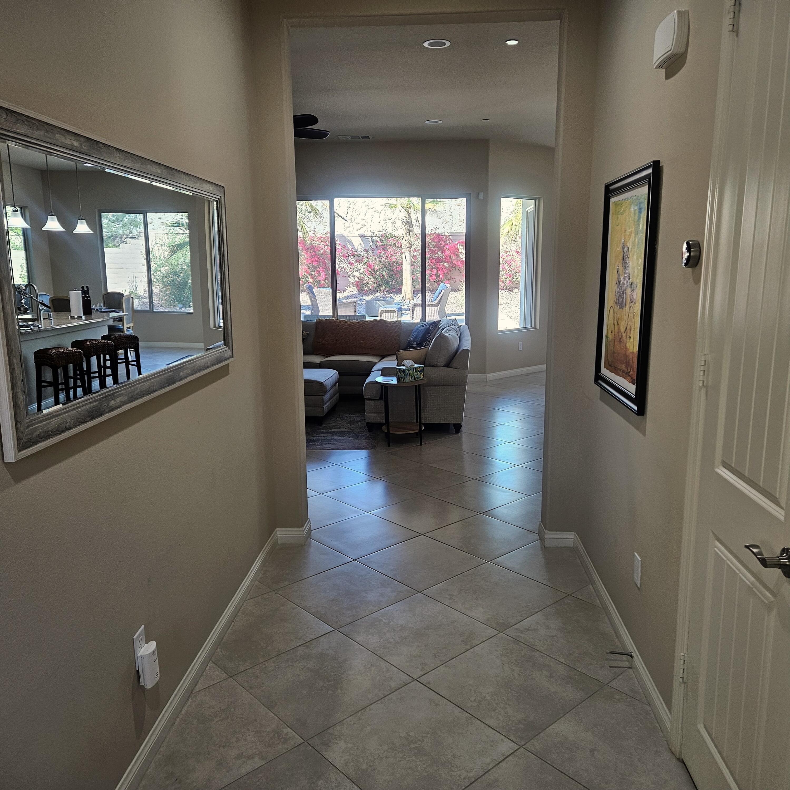 81672 Avenida Viesca Indio, CA 92203 - Photo 16 of 56 a living room with furniture and a large window