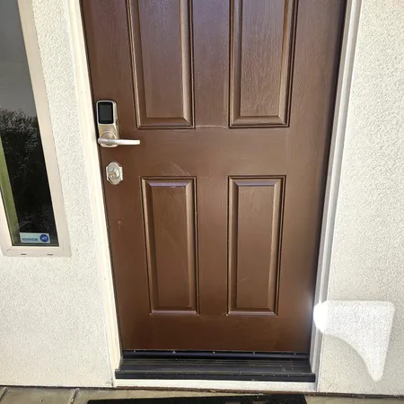 a view of a door and a window