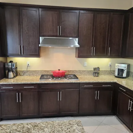 a kitchen with a sink and cabinets