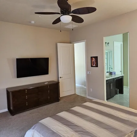 a bedroom with a bed and window