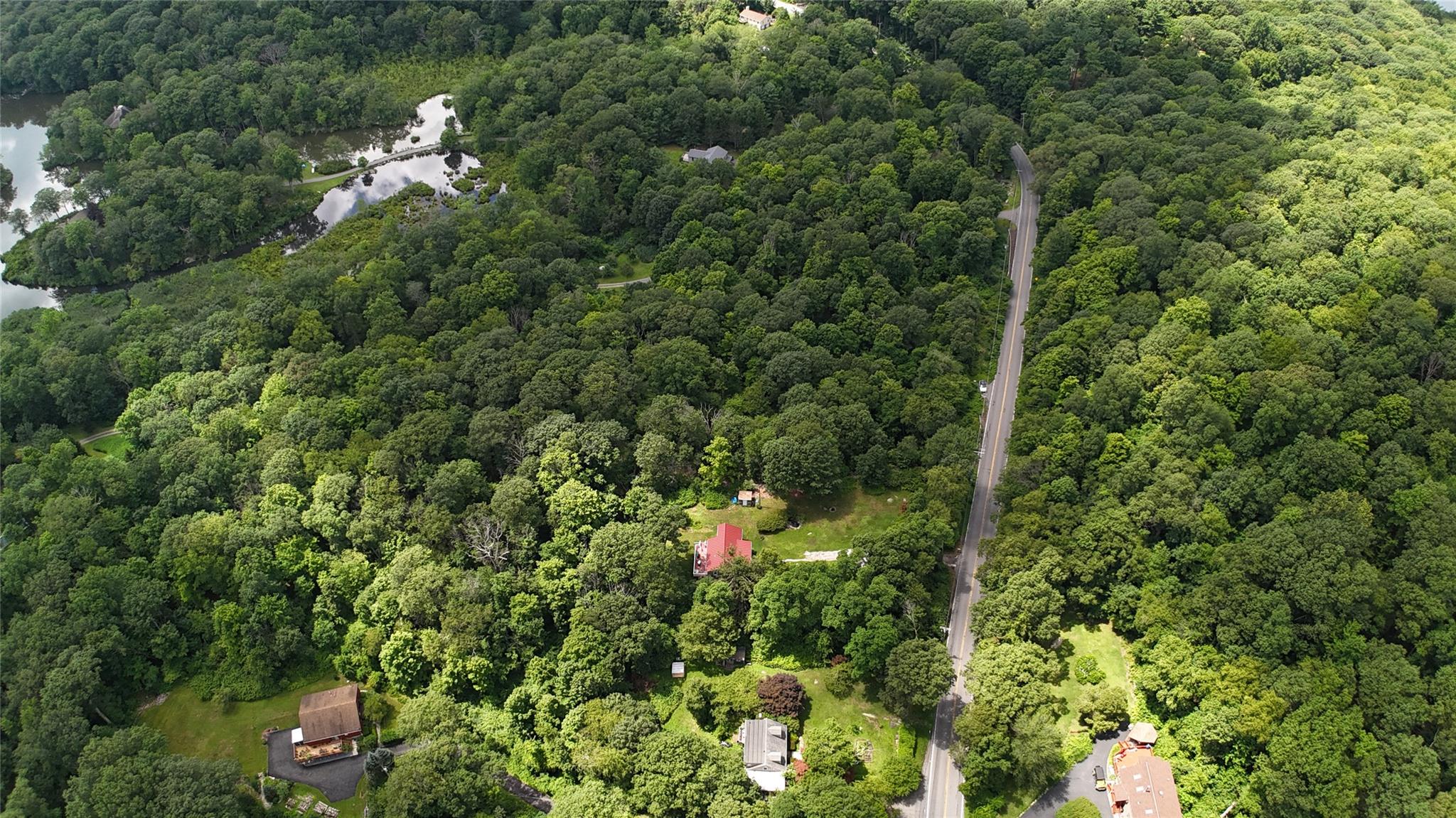 727 Farmers Mills Road Carmel, NY 10512 - Photo 4 of 31 an aerial view of a house with a yard