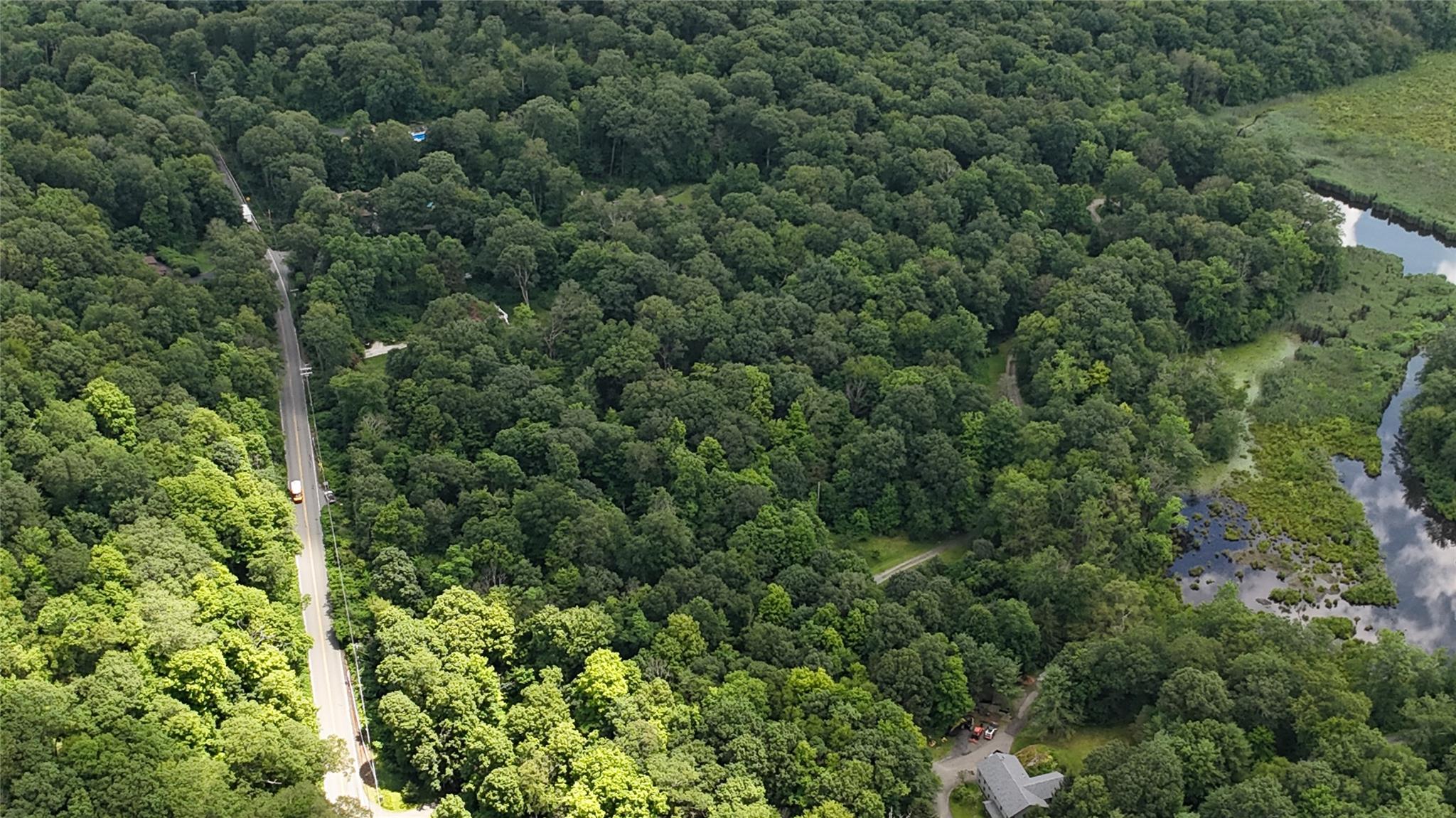 727 Farmers Mills Road Carmel, NY 10512 - Photo 7 of 31 an aerial view of a house with a yard