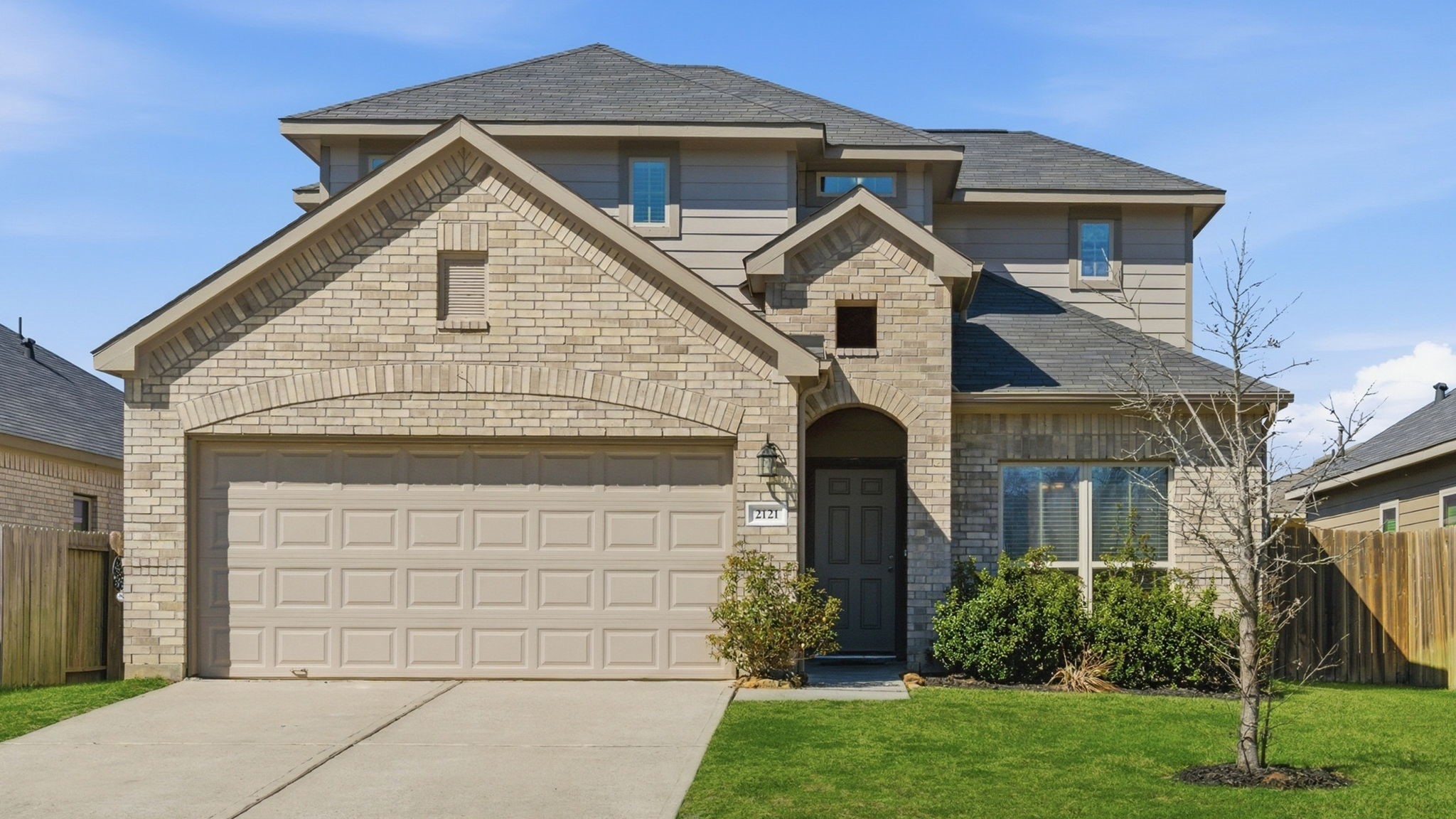 2121 Cedar Way Drive Conroe, TX 77301 - Photo 1 of 27 a front view of a house with a yard