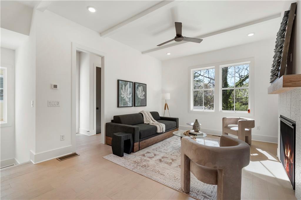 1901 Browns Mill Road Southeast Atlanta, GA 30315 - Photo 15 of 42 a living room with furniture a large window and a flat screen tv