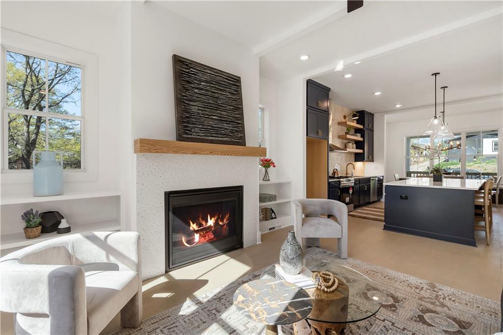 1901 Browns Mill Road Southeast Atlanta, GA 30315 - Photo 16 of 42 a living room with furniture and a fireplace