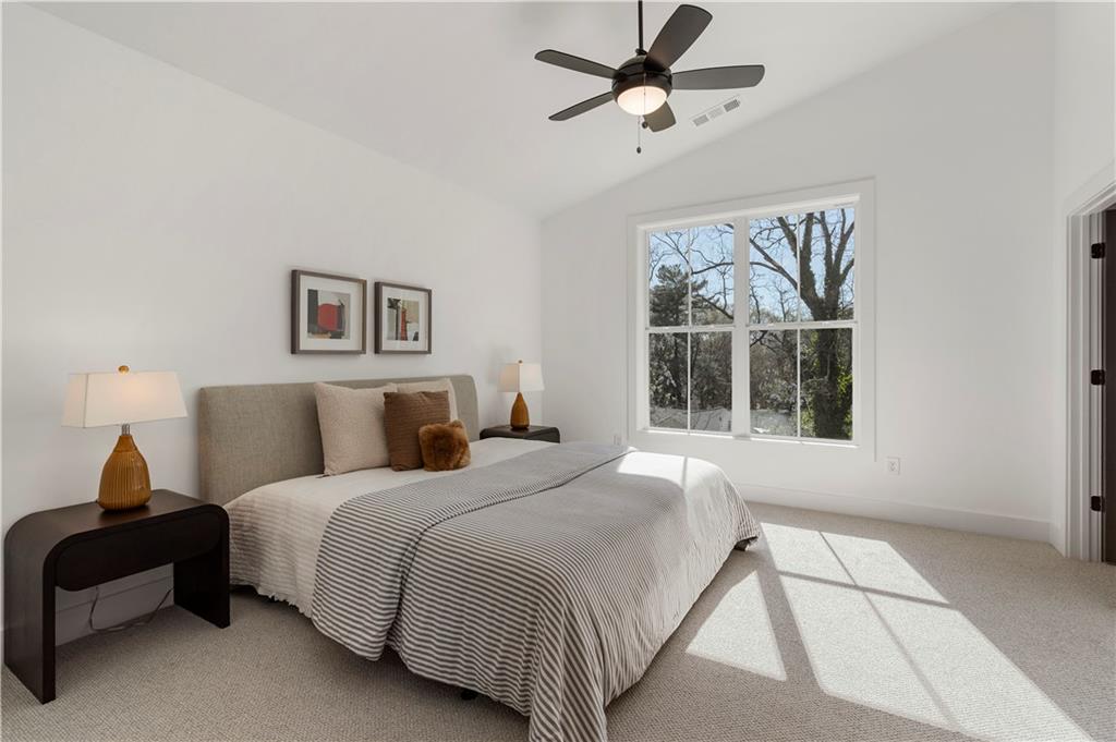 1901 Browns Mill Road Southeast Atlanta, GA 30315 - Photo 21 of 42 a bedroom with a large bed and a window