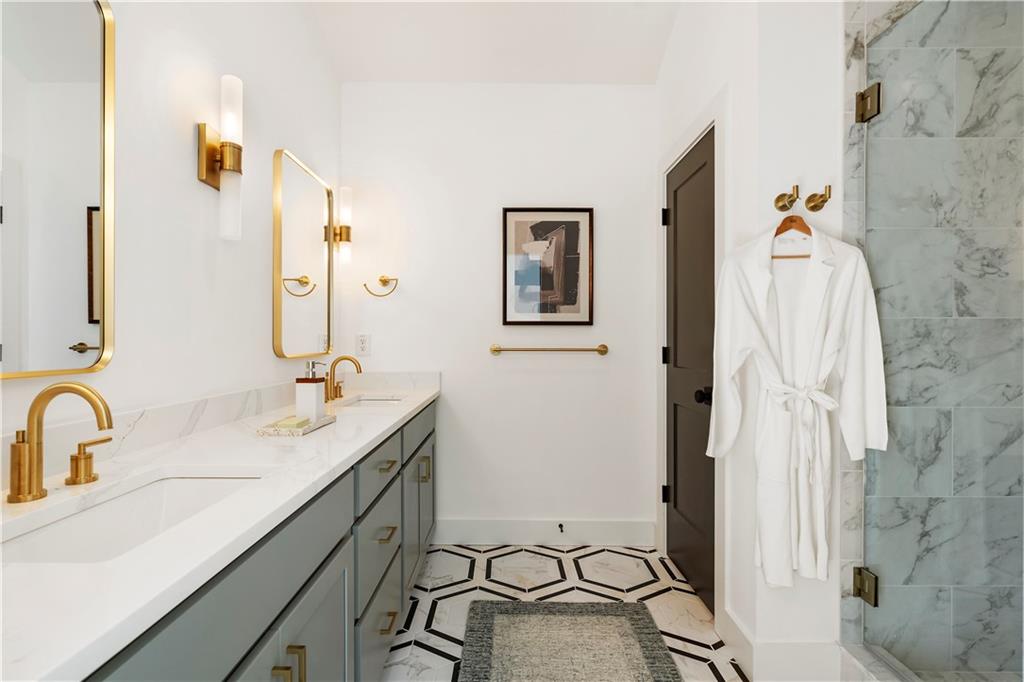 1901 Browns Mill Road Southeast Atlanta, GA 30315 - Photo 25 of 42 a bathroom with a double vanity sink mirror and