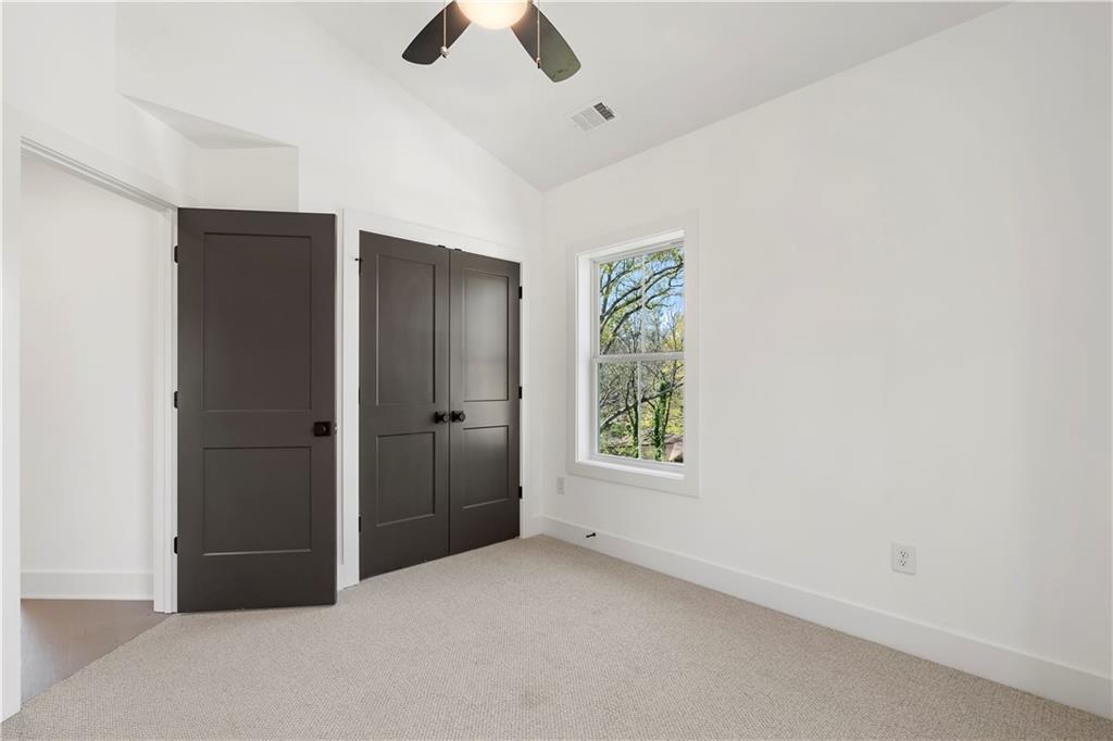 1901 Browns Mill Road Southeast Atlanta, GA 30315 - Photo 30 of 42 an empty room with windows and closet