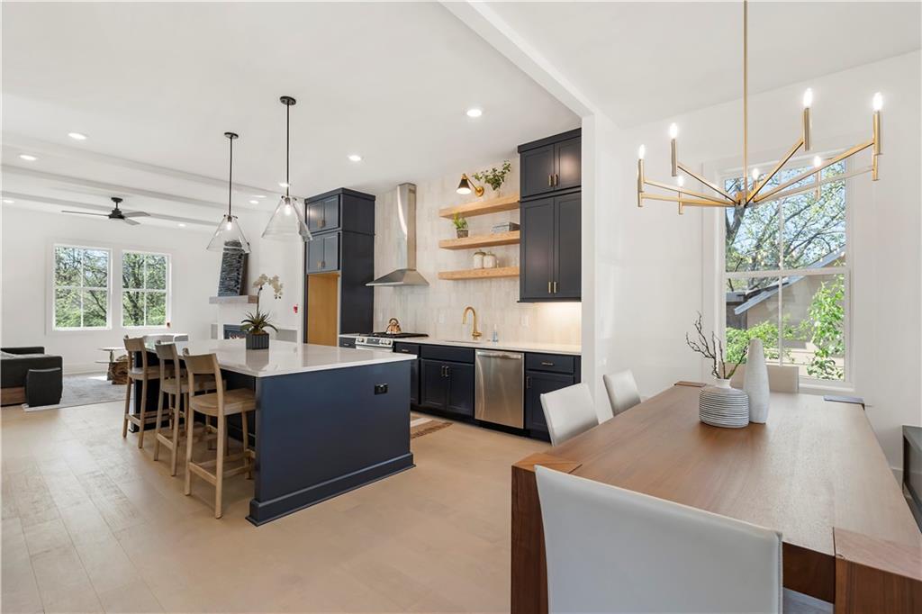 1901 Browns Mill Road Southeast Atlanta, GA 30315 - Photo 9 of 42 a large living room with stainless steel appliances kitchen island granite countertop furniture and a large window