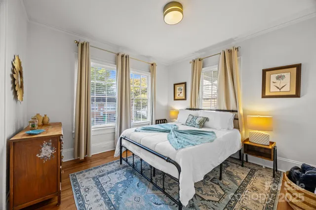 a bed room with a bed and a window