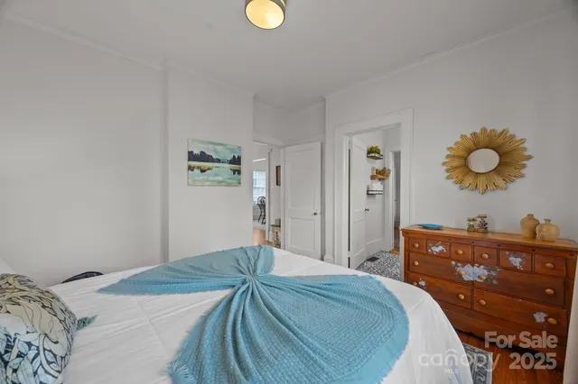 a bedroom with a bed and cabinets