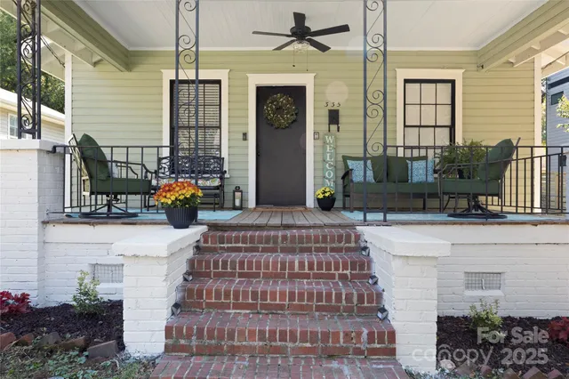 a front view of a house with outdoor seating