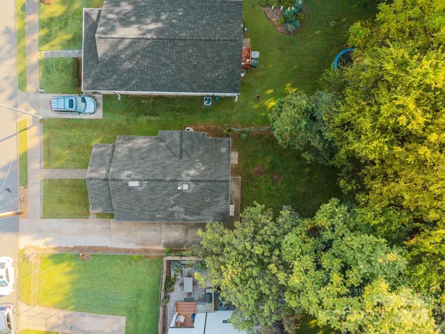 a aerial view of a house with a yard