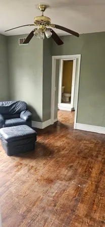 a bathroom with a tub and a window
