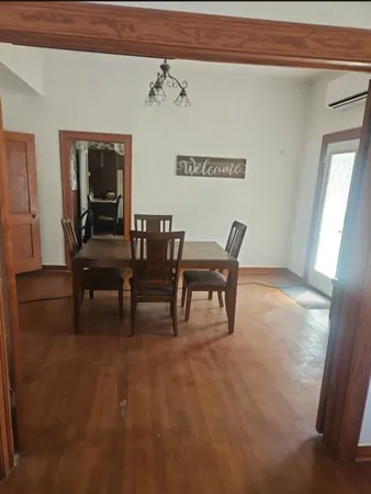 a view of a livingroom with furniture and window