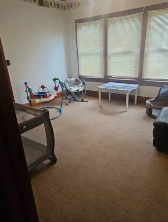 a living room with furniture and window