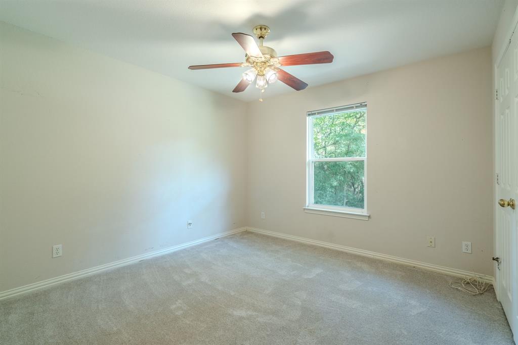 1101 Vista Verde Road Denton, TX 76210 - Photo 18 of 38 Bedroom 2 - new carpet, ceiling fan, and spacious closet.