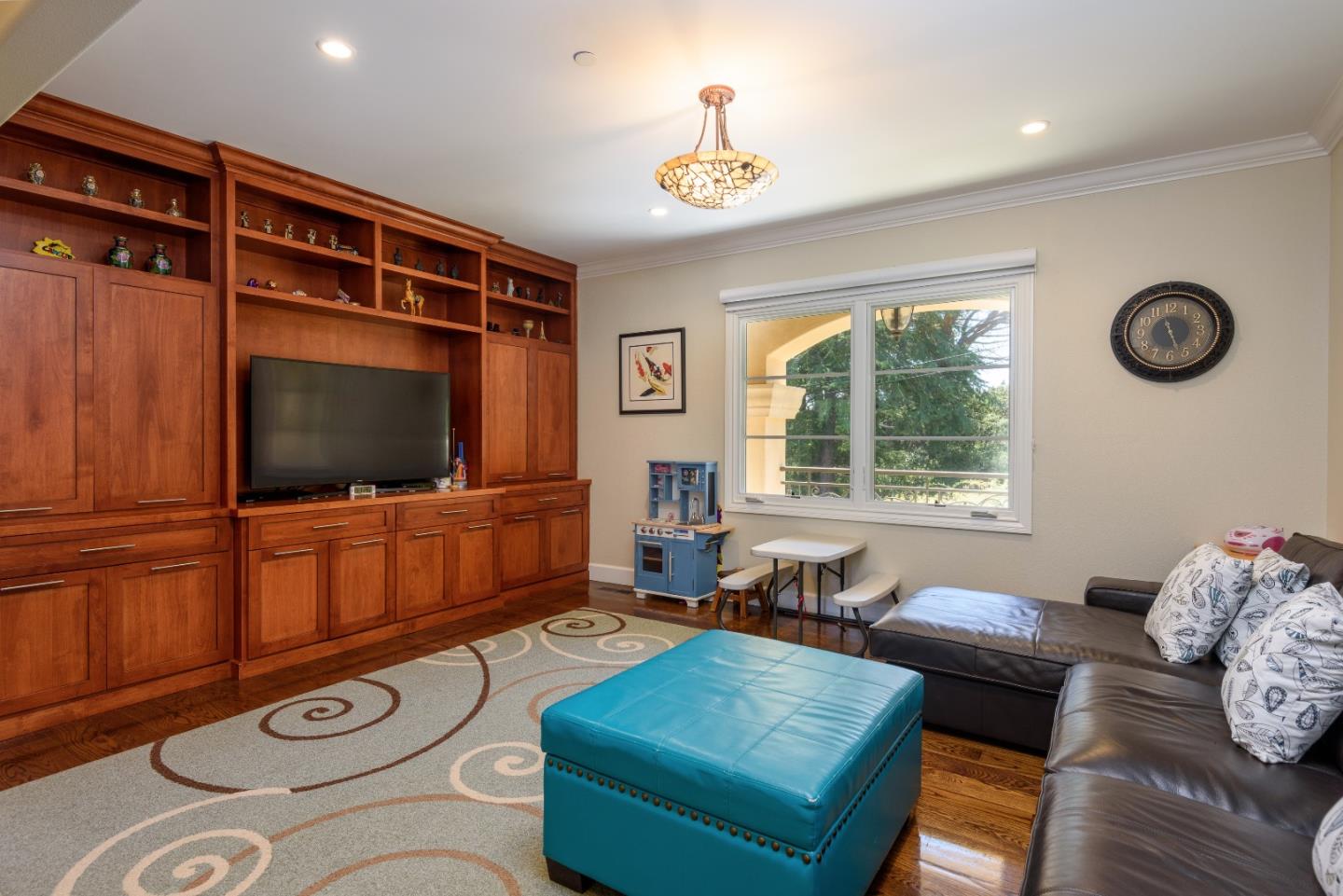 1120 Southdown Road Hillsborough, CA 94010 - Photo 11 of 28 a living room with furniture and a flat screen tv