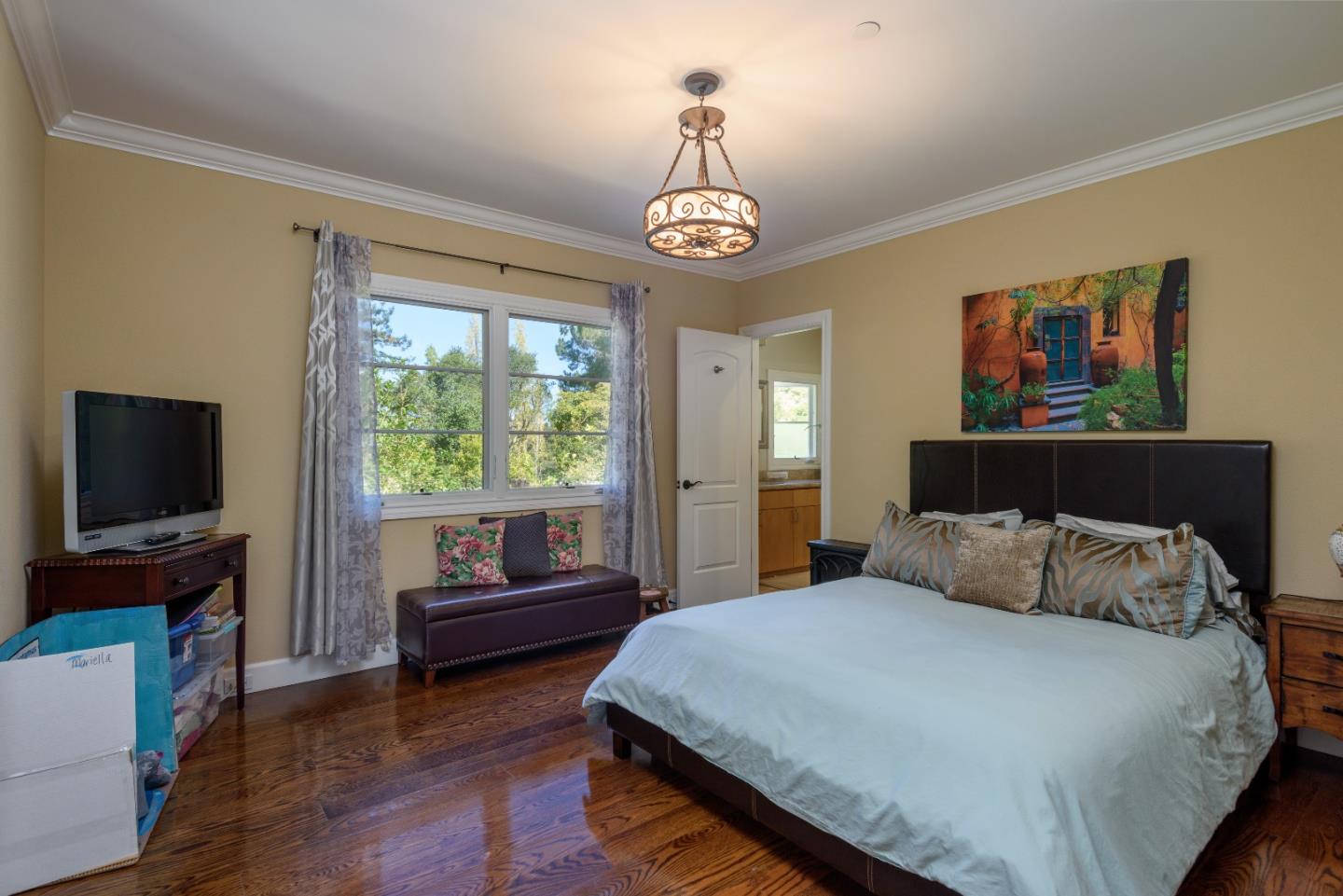 1120 Southdown Road Hillsborough, CA 94010 - Photo 14 of 28 a bedroom with a bed and a flat screen tv