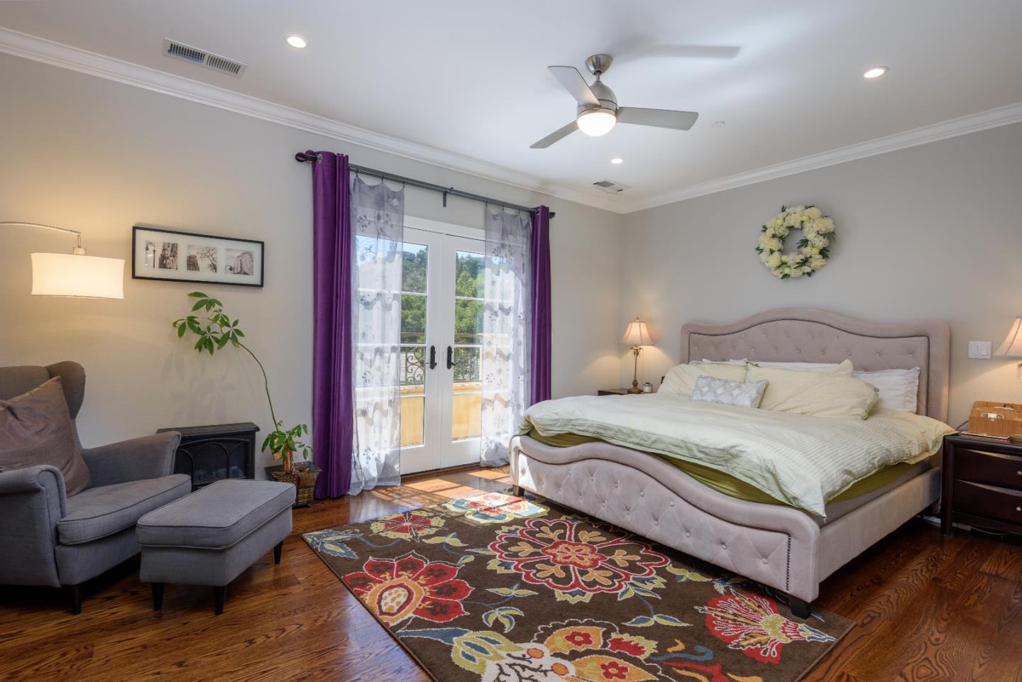 1120 Southdown Road Hillsborough, CA 94010 - Photo 16 of 28 a spacious bedroom with a bed couch and a window