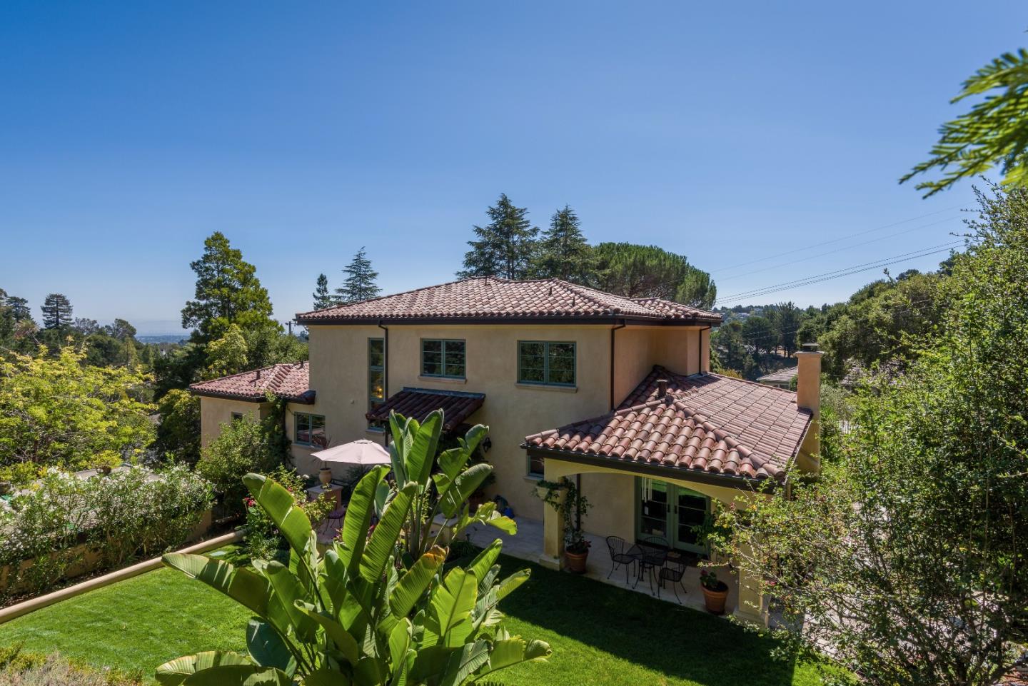 1120 Southdown Road Hillsborough, CA 94010 - Photo 27 of 28 a front view of a house with a yard and garage