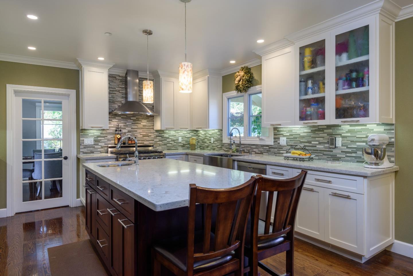 1120 Southdown Road Hillsborough, CA 94010 - Photo 7 of 28 a kitchen with center island table and chairs