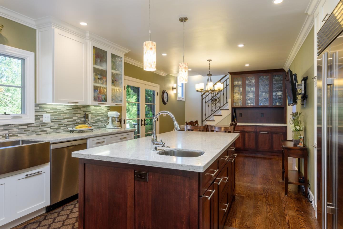 1120 Southdown Road Hillsborough, CA 94010 - Photo 8 of 28 a kitchen with a sink cabinets and window