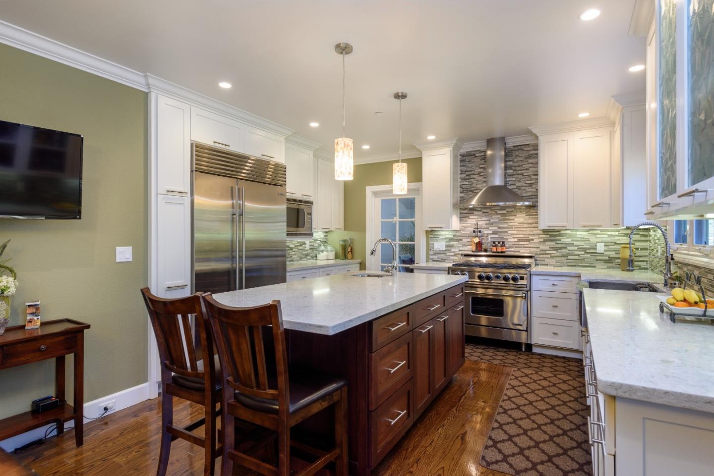 1120 Southdown Road Hillsborough, CA 94010 - Photo 9 of 28 a kitchen with stainless steel appliances granite countertop a sink stove and refrigerator