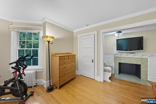 a view of a livingroom with furniture and a fireplace