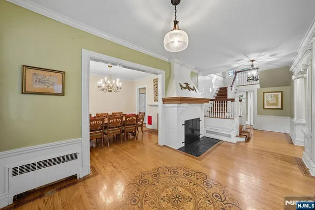 a bedroom with furniture and a fireplace