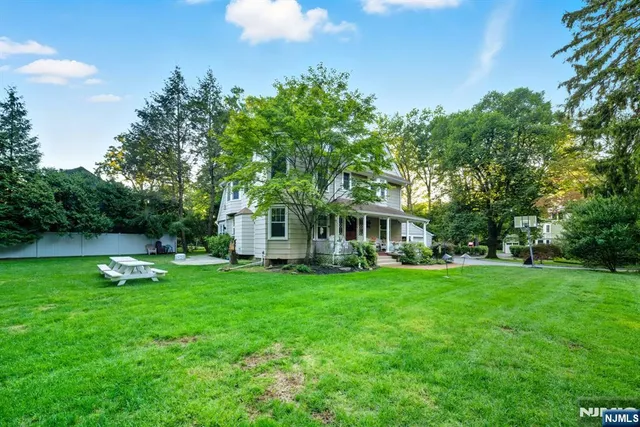 a view of a house with a yard porch and sitting area