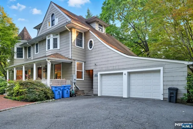 a front view of a house with a garage