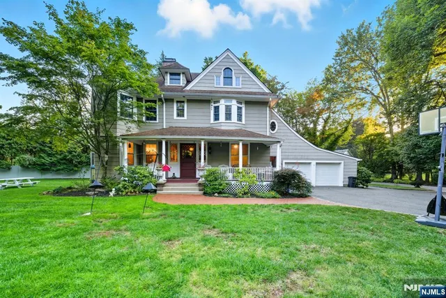 a front view of a house with a yard and porch