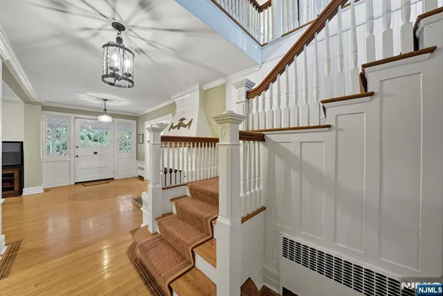 a view of entryway with wooden floor