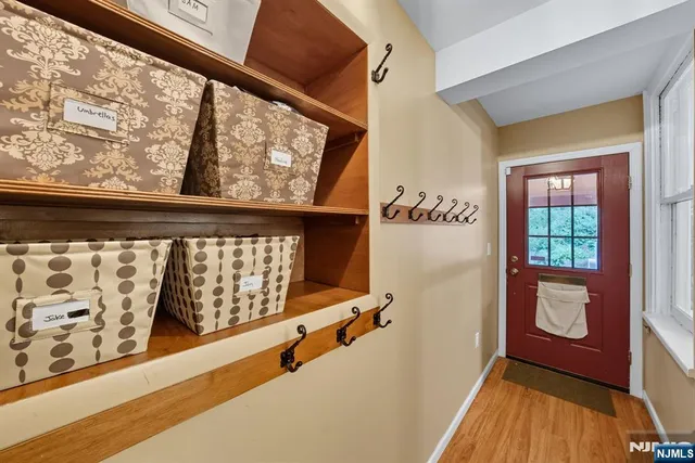 a view of front door with wooden floor