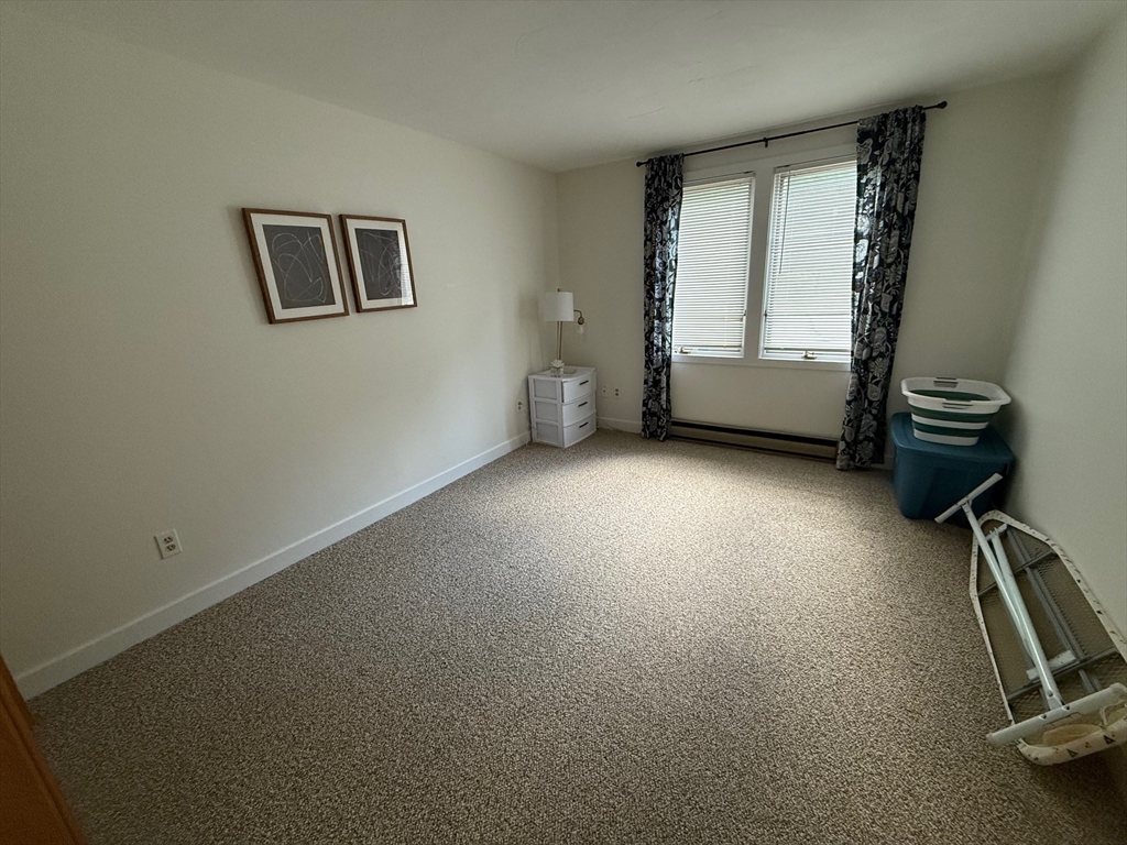 28 Maria Avenue, Unit C Southbridge, MA 01550 - Photo 6 of 11 a view of room with window and hardwood