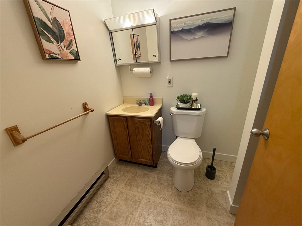 28 Maria Avenue, Unit C Southbridge, MA 01550 - Photo 7 of 11 a white toilet sitting next to a bathroom sink
