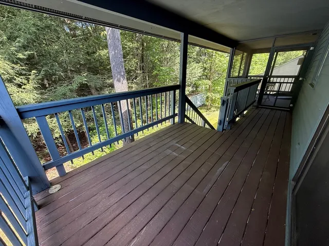 a view of two chairs in the balcony